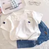 Camiseta de Manga Corta para Niños Verano 2025 Nueva Niños y Niñas Muñeca Vertical Linda Superior Coreana de Media Manga Camiseta Básica