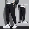 Pantalones térmicos con forro polar transfronterizos, nuevo estilo otoño/invierno, nuevos pantalones deportivos, pantalones de chándal casual para niños, pantalones jogger de corte holgado para hombre