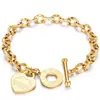 Joias de aço titânio transfronteiriças para mulheres, pulseira da moda com fecho OT e pingente de coração, pulseira de casal em formato de coração com letra em inglês
