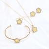 Collar y pulsera con colgante de cuatro piezas de flor de ciruelo de fritillaria negra de doble cara CDD, anillo y trébol de cuatro hojas, suministro de comercio exterior
