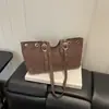 Comercio exterior remache cruzado transfronterizo estampado de leopardo texturizado 2026 gamuza nueva moda simple bolsa de mano para la ciudad para mujer