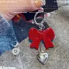 Nuevo Colgante de Bolso Rojo Angora Dongdaemun con Lazo Colgante Elegante Acrílico Colgante de Corazón Llavero