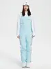 Liquidación de pantalones de esquí tipo peto para mujer, nuevos, impermeables y cálidos, chaqueta de esquí profesional para hombre, comercio exterior