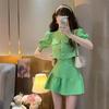 Camisa top de manga abullonada con lazo estilo xiaoxiang socialite temperamental falda plisada de cintura alta traje de dos piezas verano para mujer