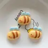 Accesorios de resina lindos de dibujos animados abeja mariposa flor DIY hechos a mano para clip de pelo de niños colgante de bolsa materiales