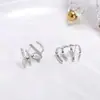 Pendientes de botón de estilo coreano de lujo ligero con garra y circonita para mujer, estilo minimalista pequeño creativo, aguja de plata 925 apta para oídos, venta al por mayor