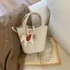 Bolso tipo cubo de moda estilo cesta para mujer, nueva colección otoño 2026, bolso de hombro estilo coreano, color liso simple, bolso cruzado de nicho