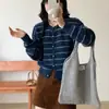 Suéter de punto de rayas de color liso estilo francés para mujer, cuello redondo, de manga larga, con botones al frente, que rejuvenece, cómodo y suave, para primavera y otoño.