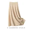 Saia Longa Plissada de Cashmere Feminina 2026 Cintura Alta Cor Sólida Solta Casual Elegante para Ir ao Trabalho Outono e Inverno Nova Malha