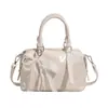 Corea del Sur Moda Tendencia Estilo Crema Simple Portátil Bolso Almohada de Cuero Suave Moda Femenina Versátil Casual para Viaje Bolso Cruzado