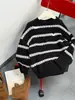 Suéter de punto a rayas de otoño e invierno Aimobebe para niños mayores, suéter rasgado de bloques de color de moda, prenda superior cálida