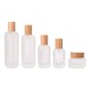 Cuidado de la piel para manchas productos envasados individualmente presión esencia loción botella de vidrio vacía tapa nueva de madera maciza botella de vidrio para crema de 50g