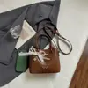 Bolso pequeño súper popular para el trabajo, nuevo de verano 2026 para mujer, patrón tejido de nicho, bolso cruzado de hombro único tipo cubo