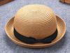 Versão coreana de chapéu de sol de palha com laço ondulado para crianças primavera e verão chapéu de sol de praia cúpula atacado