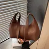 Bolsa de ombro transfronteiriça novo padrão retro de lichia estilo coreano moda casual bolsa de bolinho simples bolsa de mão de ombro único bolsa feminina tendência