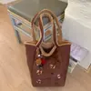 Bolsa Tote Casual de Design Nicho Novo Outono 2025 Bolsa de Mão Casual Moda Textura Retrô Bolsa de Ombro Feminina