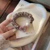 Novedad de Primavera Estilo Perla Goma para el Cabello con un Toque de Lujo, Goma Elástica Brillante de Corazón de Diamante, Cuerda para Moño, Goma para el Cabello con Anillo de Perla para Mascarilla