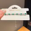 Pulseira retrátil redonda de zircônia em formato de gota d'água, um design de nicho e sofisticado, exalando elegância e estilo, um acessório versátil para atacado