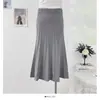 Falda de punto simple casual de color liso estilo coreano, nueva de otoño 2026, de cintura alta, corte ajustado, línea A, recta