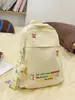 Mochila Fofa para Estudante Universitário 2025 Nova Leve Bordada Mochila de Viagem Nicho Roupas de Trabalho Versátil Ins Pequena Bolsa Escolar