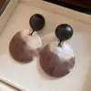Pendientes de borla con carcasa de madera marrón transfronterizos europeos y americanos, pendientes de estilo vintage Maillard, pendientes de mujer de lujo ligero de alta gama