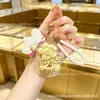 Oro puro 999 "Youqianhua" cadena para teléfono móvil de oro llavero colgante para bolso caja de regalo regalo pequeño promocional personalización cultural y creativa