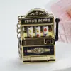 Mini Máquina de Frutas Llavero Colgante Juego de Darle Vueltas Máquina de Tigre LaBa Joyería Pequeña Sorteo Colgantes Decorativos