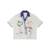 Camiseta Rumei Estilo Americano Verão Estampa Graffiti Gola Polo Manga Curta para Homens, Top Versátil Meia-Manga Soltinho Casal Retrô
