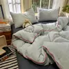 Juego de ropa de cama jacquard minimalista tejido en color de cuatro piezas, ultrasuave, 100% algodón, sábana bajera y funda de edredón tamaño individual, adecuado para residencias estudiantiles y estudiantes.