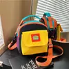 Bolso pequeño de lona estilo ins para estudiantes para mujer, bolso para teléfono móvil, nuevo bolso versátil para deportes al aire libre, bandolera, 2026