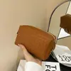 2026 Nueva Bolsa Cosmética Verde con Textura Tejida Portátil Clutch de Tacto de Alta Gama Bolso de Piel Pequeño Almacenamiento Cosméticos Bolsa Suave
