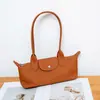 Nova Bolsa de Axila Couro Genuíno Bolsa Feminina Fashionável Couro Bovino de Primeira Camada Bolsa Longchamp Versátil para o Dia a Dia Bolsa de Ombro Única Bolsa Baguete Versátil