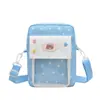 Bolso bandolera versátil de estilo nuevo de dibujos animados para niñas, lindo bolso transparente con insignia de pin, bolso simple para teléfono, bolso mini pequeño para mujer