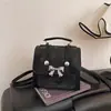 Mochila de Laço de Alta Qualidade para Mulheres Nova Moda Primavera 2026 Bolsa de Ombro Bolsa de Mão para Comércio Exterior