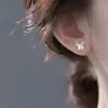 Pendientes de botón de plata 999 con diseño de mariposa brillante para mujer, diseño de nicho Ins, modernos, exquisitos, frescos, versátiles, pendientes de alta gama
