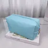 Bolsa de maquillaje de mano de venta caliente transfronteriza bolsa octagonal de color sólido bolsa de aseo portátil para mujer bolsa de almacenamiento de gran capacidad de alto valor