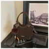 Bolso de mano pequeño de moda transfronterizo para mujer, nuevo bolso cubo de nicho de moda, bolso de hombro cruzado vintage con estampado de leopardo para el trabajo