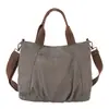 Bolsa de Lona Estilo Casual Feminina Moda Grande Capacidade Bolsa de Mão Tote Versátil para o Dia a Dia Bolsa de Ombro Único Transversal Novo Estilo 2026