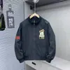 Chaqueta versátil de moda de alta gama estilo americano con bordado patchwork, cuello alto, cremallera, manga larga, para primavera/otoño, alta calle