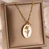 Europa y Estados Unidos collar de flor de diciembre transfronterizo nuevo flor tridimensional colgante de concha ovalada flor del mes de nacimiento cadena para la clavícula