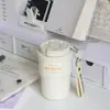 Nuevo Almacén de Té para Doble Bebida Asa de Dibujos Animados Termo de Alto Valor Mantenimiento en Frío Taza de Café de Cerámica Taza de Mano Portátil Simple