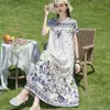 Elegante y moderno vestido de noche de algodón y seda de verano nuevo para madres de mediana edad y mayores, elegante vestido casual holgado para el hogar para mujer