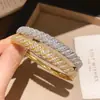 Pulsera de estilo transfronterizo europeo y americano con cierre retorcido de circonita, diseño simple y versátil, sensación de lujo ligero y alta gama, joyería para mujer