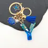 Llavero de Letra Serie Océano Personalizado Estrella de Mar Concha Perla Borla Colgante de Llavero en Inglés Temu Dropshipping