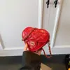 Nova Bolsa Infantil 2026 Mini Porta-Moedas em Formato de Coração Bolsa Transversal com Corrente para Meninas Bolsa Feminina Texturizada da Moda