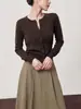 Venta al por mayor Ropa de mujer Transfronteriza Artículo Popular 2026 Otoño Nuevo Estilo Adelgazante Temperamento Cuello Redondo Un Botón Manga Larga Tejido de Punto