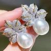 Pendientes Cao Shi con perlas de imitación, hojas transfronterizas europeas y americanas, con brillantes incrustaciones de circonita, elegantes y ligeros pendientes de lujo para mujer.