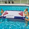 Fila flotante inflable directa de fábrica 24 agujeros Agujero para taza barra de hielo de bebida de cerveza juguete acuático mesa de juego de tenis de mesa de Coca-Cola