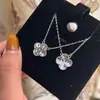 Colar de Trevo de Quatro Folhas Gelo Triturado Dourado Edição Limitada de Ano Novo Pulseira de Cinco Flores Escama de Dragão Triturada Flash Dupla Face Suprimento ao Vivo