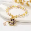 25 Novo Pingente de Margarida de Zircônia Colorida Outono e Inverno Pérola de Água Doce Fivela Ot Pulseira de Cristal Colar Doce Acessível Luxo Sensação de Alto Padrão
